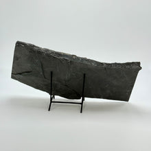 Load image into Gallery viewer, Large dark shale stone slab on a stand against a white background