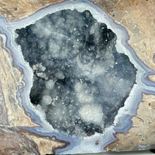 Load image into Gallery viewer, Close-up of a dugway geode with crystal formation inside