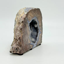 Load image into Gallery viewer, Geode with internal crystal structure on a white background