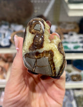 Load image into Gallery viewer, Septarian shaped and polished with crystal interior cavity