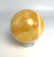 Load image into Gallery viewer, Honeycomb Calcite from Utah carved and polished into a stunning sphere with bright colors and unique pattern