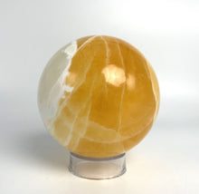 Load image into Gallery viewer, Honeycomb Calcite from Utah carved and polished into a stunning sphere with bright colors and unique pattern