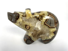 Load image into Gallery viewer, Utah Septarian Geode carved and polished into a long neck bear with a unique barite and calcite crystal interior
