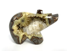 Load image into Gallery viewer, Utah Septarian Geode carved and polished into a long neck bear with a unique barite and calcite crystal interior