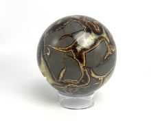 Load image into Gallery viewer, Utah septarian geode sculpted into a unique, one-of-a-kind stunning sphere.
