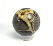 Load image into Gallery viewer, Utah septarian geode sculpted into a unique, one-of-a-kind stunning sphere.