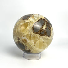 Load image into Gallery viewer, Utah septarian geode sculpted into a unique, one-of-a-kind stunning sphere.