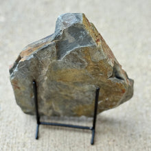 Load image into Gallery viewer, Large rough shale on a stand against a neutral background