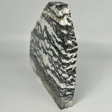 Load image into Gallery viewer, Geological sample Utah Zebra Marble slab with black and white stripes on a gray background