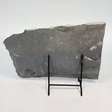 Load image into Gallery viewer, Large shale stone slab on a black metal stand.