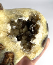 Load image into Gallery viewer, Septarian geode carved and polished with beautiful smoky calcite crystals