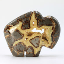 Load image into Gallery viewer, Septarian geode carved and polished into a bison with beautiful calcite crystals in the center
