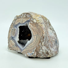 Load image into Gallery viewer, Geode with a clear cavity on a white background
