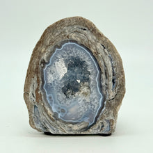 Load image into Gallery viewer, Utah Dugway Geode with an agate lined quartz crystal interior cavity with a felt tab base
