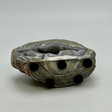 Load image into Gallery viewer, Dugway Geode with internal crystal structure standing on felt tabs
