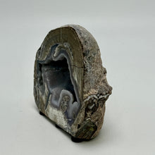 Load image into Gallery viewer, Utah Dugway Geode cut and polished with crystal formation on a white background
