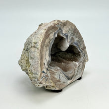 Load image into Gallery viewer, Geode with a crystal inside on a white background
