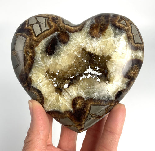 Utah Septarian Geode Heart sculpted and polished from a Septarian geode with a stunning calcite crystal hollow interior