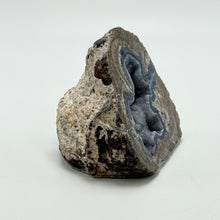 Load image into Gallery viewer, Geode with internal crystal formation on a white background
