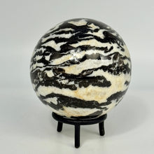 Load image into Gallery viewer, Zebra marble black and white striped pattern sphere on a stand against a white background
