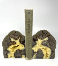 Load image into Gallery viewer, Septarian Bookend with a stunning polished face and small calcite crystal filled cavity with book
