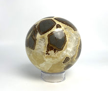Load image into Gallery viewer, Utah septarian geode sculpted into a unique, one-of-a-kind stunning sphere.
