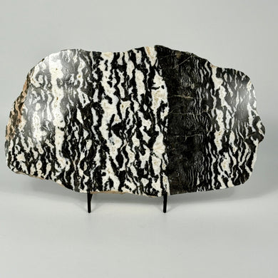 Decorative zebra marble slab with black and white pattern on a gray background