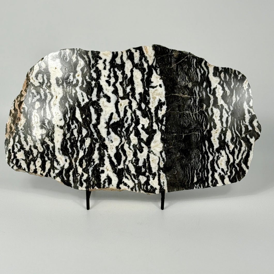 Decorative zebra marble slab with black and white pattern on a gray background