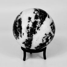 Load image into Gallery viewer, Black and white marbled sphere on a stand against a light gray background
