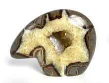 Load image into Gallery viewer, Utah Septarian Geode carved and polished into a zuni bear with a unique barite and calcite crystal interior
