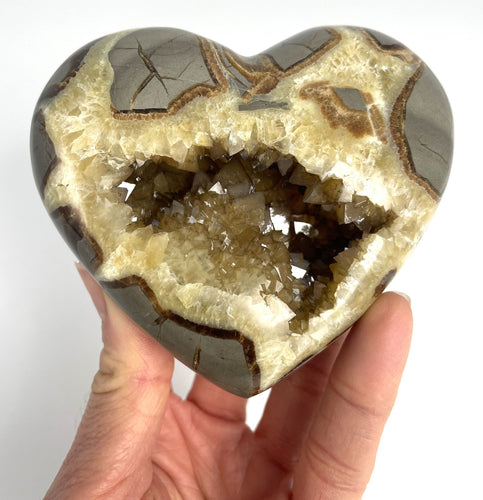Utah Septarian Geode Heart sculpted and polished from a Septarian geode with a stunning calcite crystal hollow interior