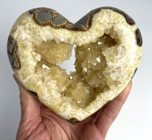 Utah Septarian Geode Heart sculpted and polished from a Septarian geode with a stunning calcite crystal hollow interior