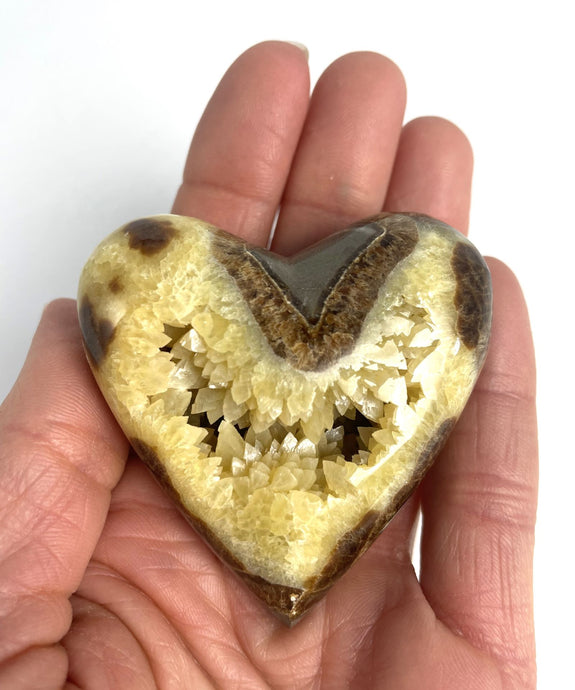 Utah Septarian Geode Heart sculpted and polished from a Septarian geode with a stunning calcite crystal hollow interior