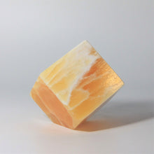 Load image into Gallery viewer, 3 inch calcite cube that stands on it&#39;s corner cut base
